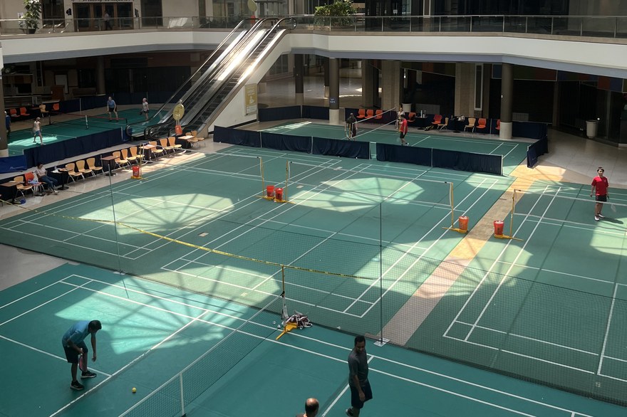 Pickleball courts with players inside the former food court of Chesterfield Mall, a converted shopping mall