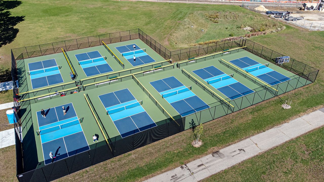 Aerial view of pickleball courts in a park