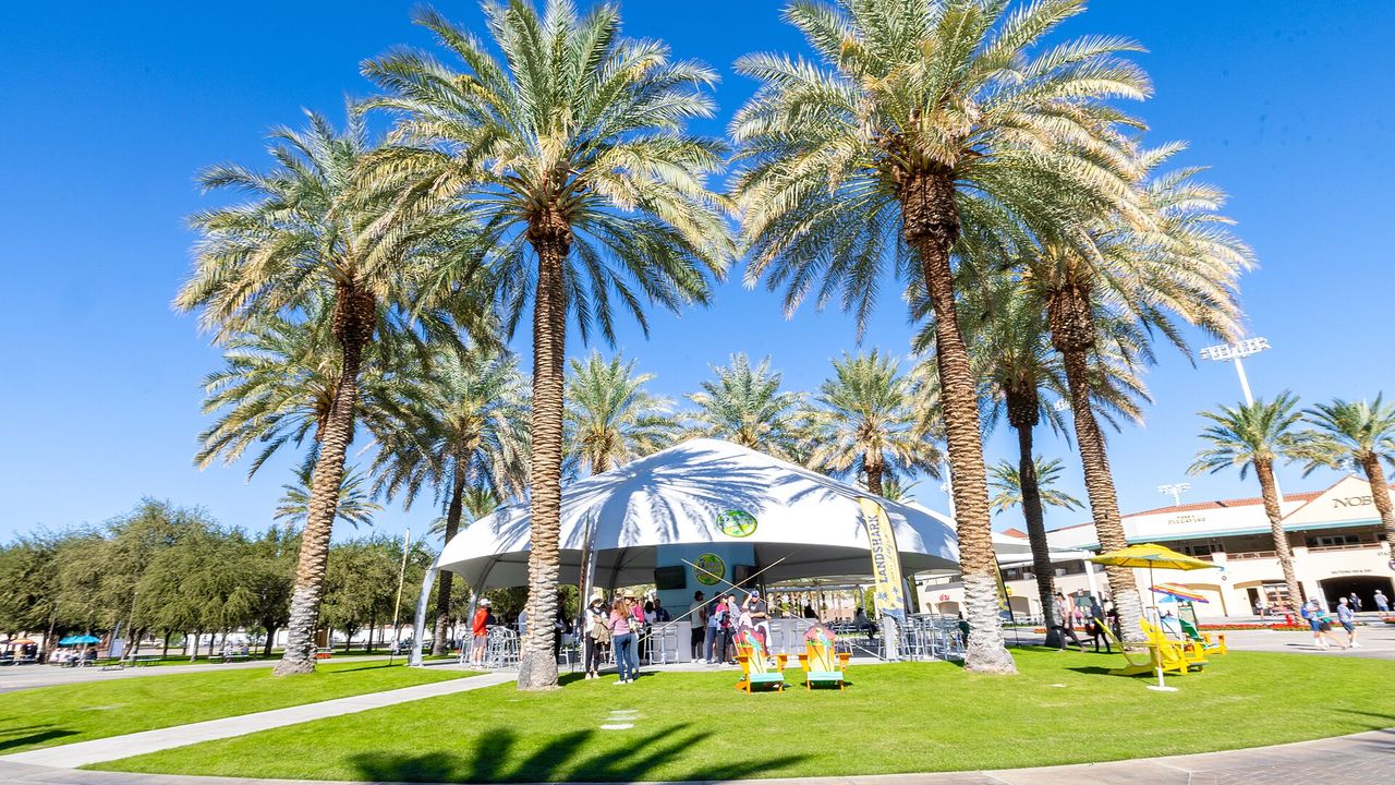 Event structure and palm trees at the Indian Wells Tennis Garden during a 2022 pickleball tournament